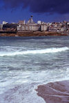 Galicia / Galiza - A Corua: waves and and city skyline in the background - photo by S.Dona'