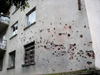 Abkhazia - Sukhumi: bullet holes on a wall - photo by A.Kilroy