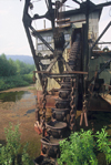 Alaska - Yukon river: old machine for gold extraction - photo by E.Petitalot