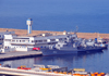 Oran - Algrie: le port - la frgate Rais Korfu (903) et le difice de la Societe General Maritime - Bassin Mostagane - photo par M.Torres