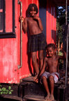 Angola - Luanda - kids near a red railroad car, their house - midos junto a uma carruagem ferroviria vermelha, a sua casa - images of Africa by F.Rigaud