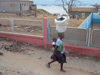 Angola - Luanda: woman on the move / mulher com bb e carga na cabea - photo by A.Parissis