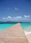 Blowing Point, Anguilla: old wooden pier, Saint Martin in the background - photo by M.Torres