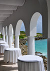 Maundays Bay, West End Village, Anguilla: empty tables by the sea - arcade at Cap Juluca five-star resort - photo by M.Torres