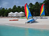 Maundays Bay, West End Village, Anguilla: Caribbean beach scene - mini-catamarans and beach gazebos - Cap Juluca hotel - photo by M.Torres