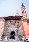 Aragon - Aragn - Calatayud: gate and the mudejar tower of the Colegiata de Santa Maria (photo by M.Torres)