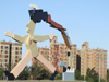 Argentina - Crdoba - modern art - statue with AIDS ribbon against residential blocks - images of South America by M.Bergsma