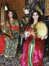 Azerbaijan - Baku: Niyazi House Museum - Azeri women in traditional costume playing local instruments (photo by Galen Frysinger)