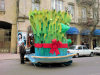 Baku, Azerbaijan: Novruz decoration in the city - a man looks at a giant Semeni, sprouting wheat - photo by N.Mahmudova