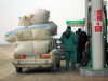 Salyan road, Azerbaijan: petrol station - overloaded car - Lada - photo by F.MacLachlan