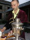 Sheki / Shaki - Azerbaijan: man in Caucasian garb serves tea - samovar - photo by N.Mahmudova