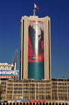 Manama, Bahrain: car park building and National Bank of Bahrain - the King's image in giant format - photo by M.Torres