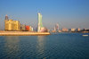 Manama, Bahrain: Reef Island - One Bahrain development on the left and BFH towers in the center - Manama skyline - late afternoon light in the fishing harbour - photo by M.Torres