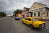 Mir, Karelicy raion, Hrodna Voblast, Belarus: yellow car, bank, street and Orthodox church of the Holy Trinity - photo by A.Dnieprowsky