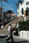Bermudas - St. George: St Peter's Anglican church, built in 1615 by Bermudas first governor, Richard Moore - Church of England - man leading the procession - photo by G.Frysinger