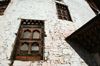 Bhutan - Paro: wall of Bhutan's national museum - windows - photo by A.Ferrari