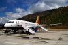 Bhutan - Paro: Druk Air Airbus A319-100 on the ramp, upon arrival in Paro airport - Royal Bhutan Airlines - KB - photo by A.Ferrari