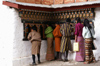 Bhutan - Bhutanese people rolling prayer wheels, in Chari Goemba - photo by A.Ferrari