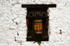 Bhutan - Jampa Lhakhang - white wall with prayer wheels - photo by A.Ferrari