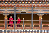 Bhutan, Paro: Monks on balcony of inner courtyard of Paro Dzong - photo by J.Pemberton