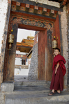 Bhutan, Thimpu, Young Monk by entrance to Dzong - photo by J.Pemberton
