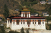 Bhutan - Paro: Paro Dzong, in the late afternoon light, aka Rinpung Dzong - administration center and school for monks - photo by A.Ferrari