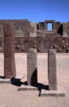 Tiwanaku / Tiahuanacu, Ingavi Province, La Paz Department, Bolivia: three steles in the Semi-Underground Temple  Kalasasaya gate in the background - Templete semisubterrneo - UNESCO world heritage site - photo by C.Lovell
