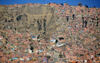 El Alto, La Paz department, Bolivia: cascade of brick and mud cubic dwellings on the western side of the canyon of the river Choqueyapu - rim of the Altiplano - photo by M.Torres