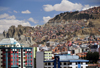 La Paz, Bolivia: eroded scarps and modest houses in the suburbs - photo by M.Torres