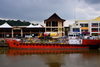 Bangar, Temburong District, Brunei Darussalam: oil products tanker Balait Surita on the Temburong river and commerce along the waterfront - photo by M.Torres