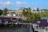 Bandar Seri Begawan, Brunei Darussalam: Kampong Pg. Kerma Indra Lama water village with the Yayasan Shopping Complex and the city center in the background - photo by M.Torres