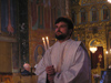 Bulgaria - Sofia: Inside Sveta Nedelya Cathedral - Bulgarian Orthodox priest with candles (photo by J.Kaman)