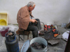 Bulgaria - Koprivshtitsa: man preserving paprikas for winter (photo by J.Kaman)