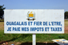 Ouagadougou, Burkina Faso: billboard with campaign promoting the payment of taxes by the citizens - photo by M.Torres