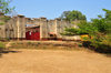 Gitega / Kitega, Burundi: old German fort - red gate and acacia - photo by M.Torres