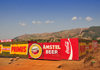 Rutana province, Burundi: Primus and Amstel beers sponsor a construction site wall, together with Coca-Cola - photo by M.Torres
