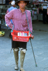 Cambodia: this man lost his legs in a landmine blast - amputee with prosthetic legs - prosthesis - photo by E.Petitalot