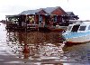 Siem Reap: Vietnamese floating village - human tug-boat
