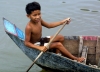 Cambodia / Cambodge - Chong Khneas floating village: young boy paddles (photo by R.Eime)