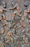 Cameroon, Douala: wood carving displaying native workers in the cocoa harvest - building door in downtown Douala - photo by M.Torres