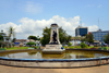 Cameroon, Douala: colonial heart of the city, the Government Square with a pond and the 1919 French monument honouring the death of World War I -  Place du Gouvernement, Le monument aux Morts - photo by M.Torres