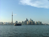 Toronto, Ontario, Canada / Kanada: skyline and Toronto Islands ferry in the Inner Harbour - day - photo by R.Grove