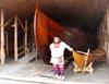 Canada / Kanada - Anse-aux-Meadows - Great Northern Peninsula, Newfoundland: a Viking and his ship - photo by B.Cloutier