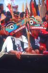 Vancouver, BC, Canada: Native North Amerian Indians wearing Indian art headgear in war canoes during canoe gathering at Capilano River, West Vancouver - photo by D.Smith