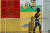 So Filipe, Fogo island - Cape Verde / Cabo Verde: woman walking - railing and mural - photo by E.Petitalot