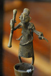 Central African Republic figurine - woman with mortar and pestle, preparing cassava flour - photo by M.Torres
