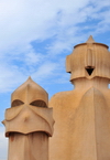 Barcelona, Catalonia: angry chimney and smiling access tower, roof of Casa Mil, La Pedrera, by Gaudi - UNESCO World Heritage Site - photo by M.Torres