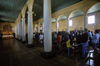 Dalcahue, Chilo island, Los Lagos Region, Chile: interior with worshipers of the neoclassical 19th century church - Doric columns - Patrimonio de la Humanidad - photo by C.Lovell