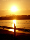 China - Hainan Island: beach - female silhouette at sunrise (photo by G.Friedman)