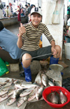 China - Hainan Island: fish seller (photo by G.Friedman)